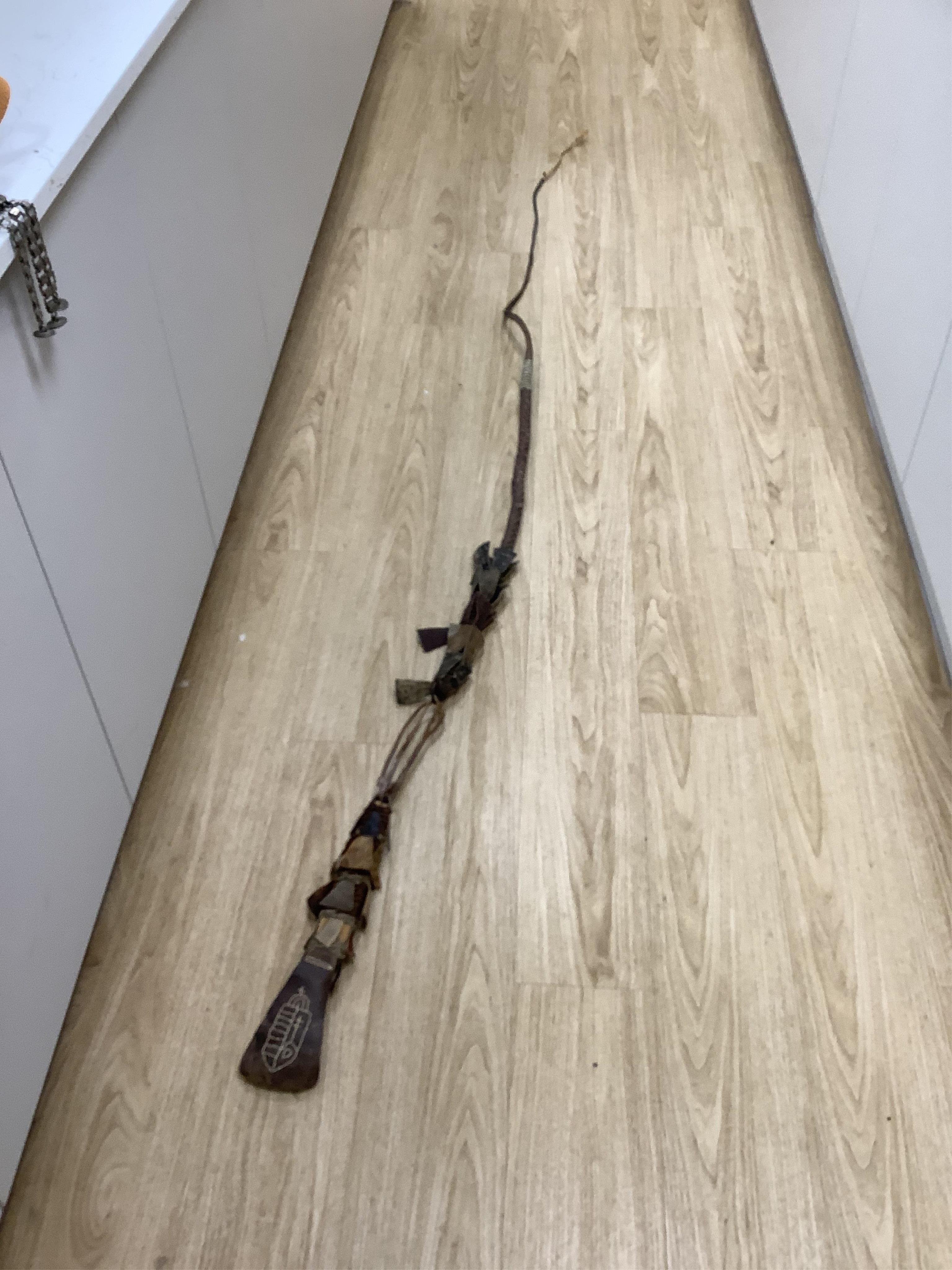 A group of Argentinian Gaucho spurs, bolas, bull whip, daggers and hanger, Longest 100cm